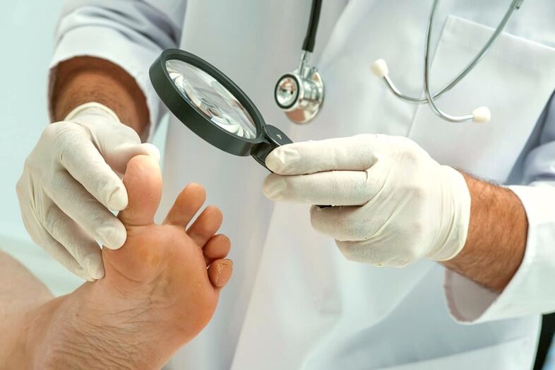 a dermatologist examines the toenails